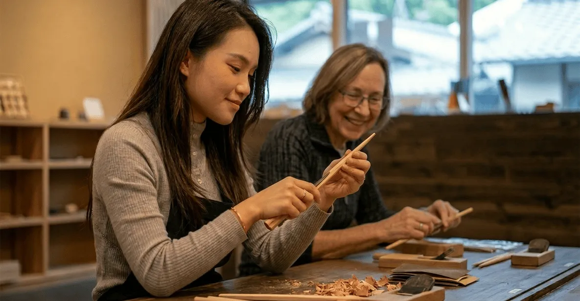 Wooden chopsticks being shaped in a traditional Asakusa studio during a chopstick making session in Tokyo
